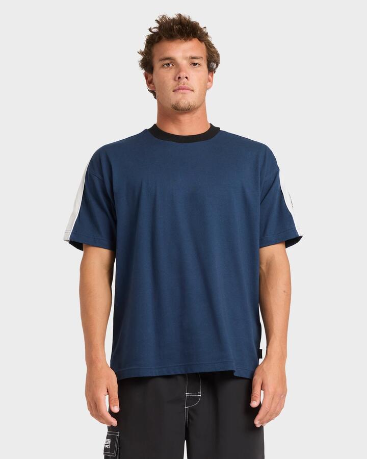 Image of a model wearing Tops. Productname: billabong - Mens Spec 73 Iconic T-Shirt - Vintage Indigo - in Vintage Indigo colour by brand - billabong