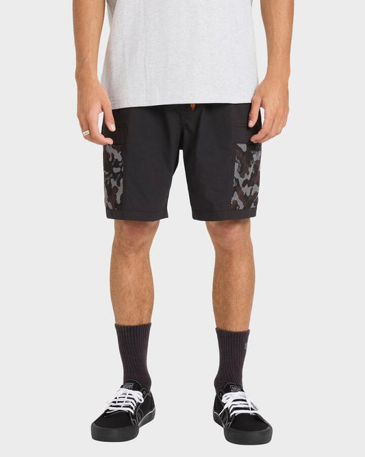 Image of a model wearing Shorts. Product name - Billabong Mens Otis Mesh 18" Walkshorts Black in Black colour by brand - Billabong