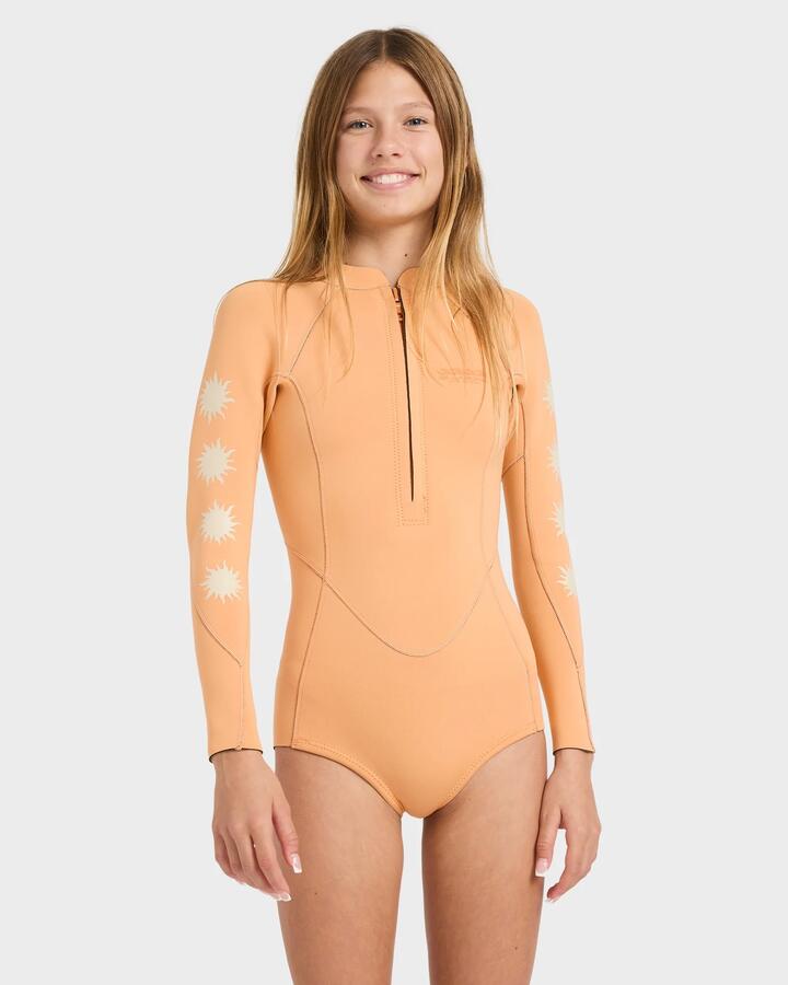 Image of a model wearing Tops. Product name - Billabong Girls 8-14 2/2Mm Salty Dayz Natural Long Sleeve Springsuit Tangerine in Tangerine colour by brand - Billabong