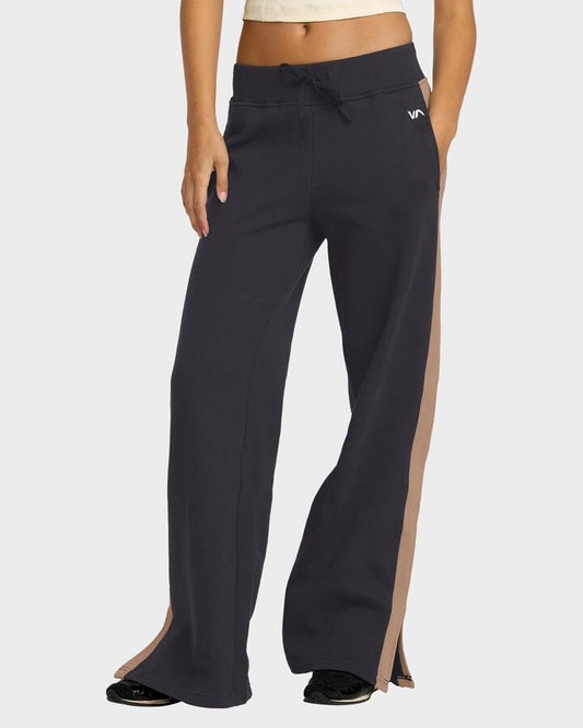 Image of a model wearing Pants. Productname: rvca Womens Benchwarmer Trackpants Washed Black - in Washed Black colour by brand - Rvca
