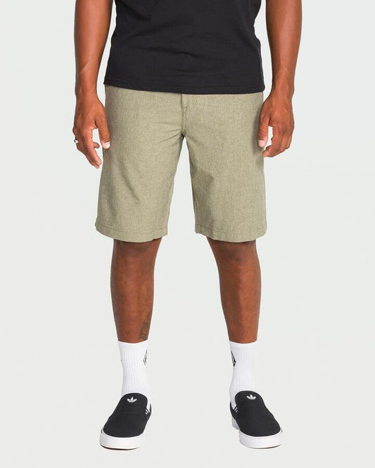 Image of a model wearing Shorts. Productname: Volcom - Mens Kerosene Hybrid Shorts - Wintermoss - in Wintermoss colour by brand - Volcom