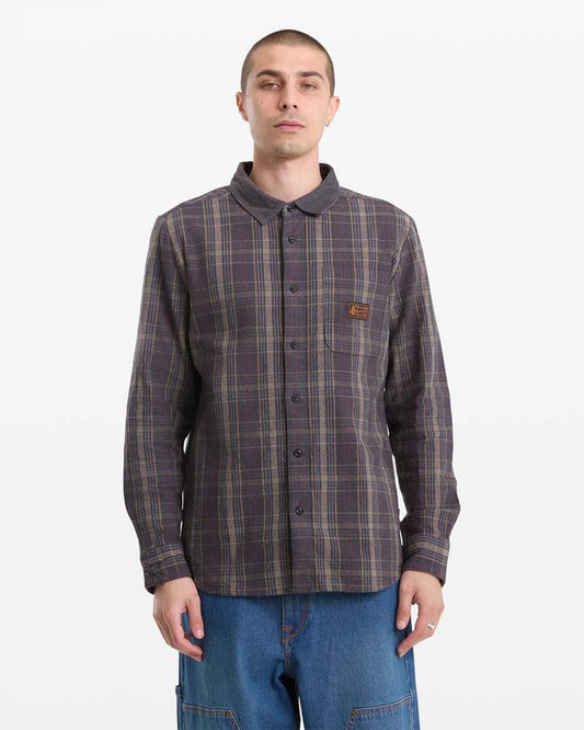 Image of a model wearing Tops. Product name - Volcom Mens Stonevise Plaid Long Sleeve Shirt Asphalt Black in Asphalt Black colour by brand - Volcom
