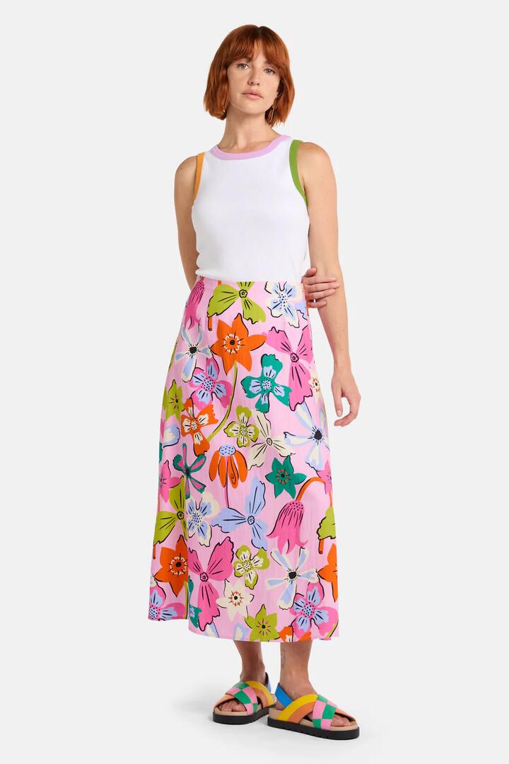Image of a model wearing Skirts. Product name - Smell The Flowers Midi Skirt in Print colour by brand - Gorman