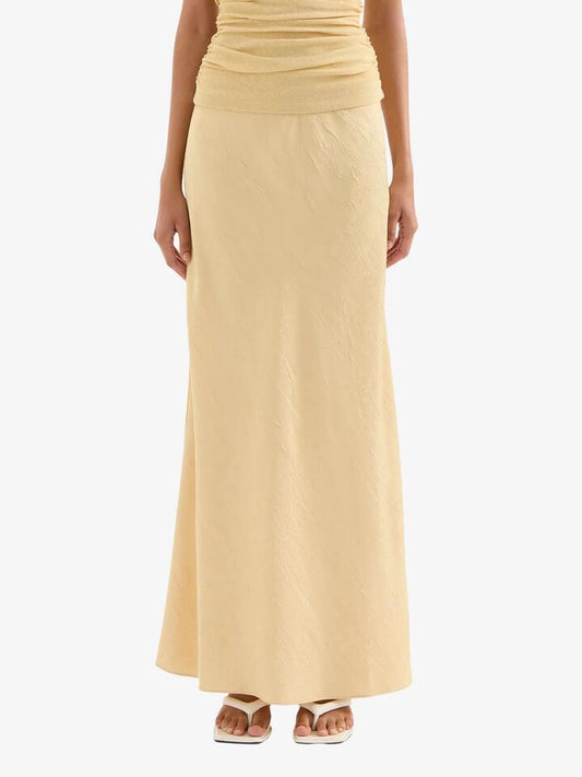 Image of a model wearing Skirts. Productname: Nude Lucy Pandora Maxi Skirt in Butter colour by brand - Nude Lucy
