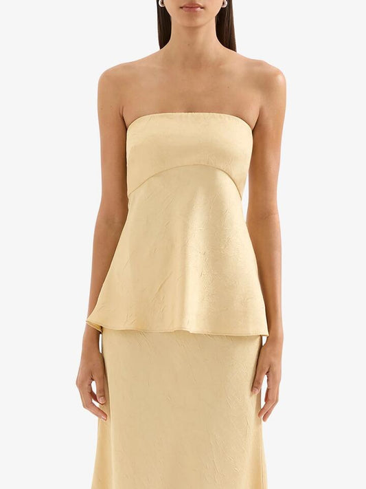 Image of a model wearing Tops. Productname: Nude Lucy Pandora Strapless Top in Butter colour by brand - Nude Lucy