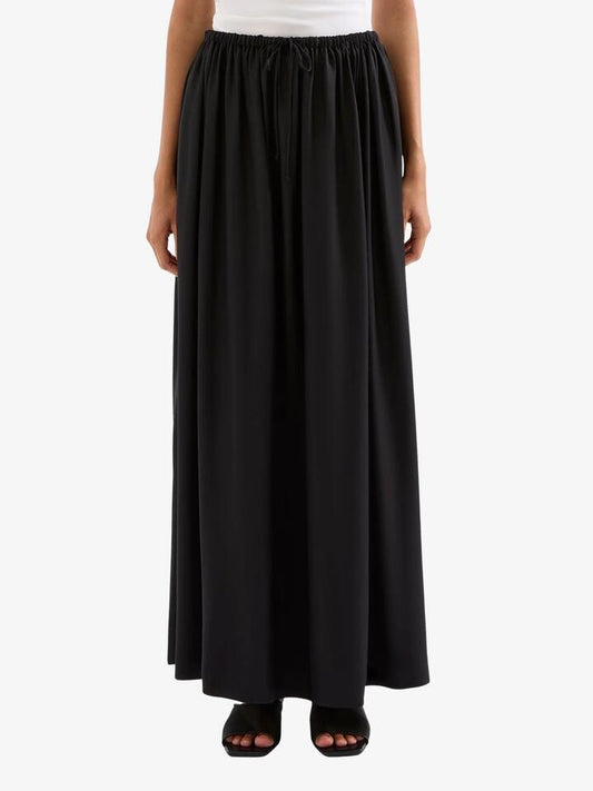 Image of a model wearing Skirts. Productname: Nude Lucy Leandra Maxi Skirt in Black colour by brand - Nude Lucy