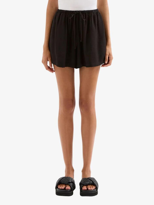 Image of a model wearing Shorts. Productname: Nude Lucy Mona Shorts in Black colour by brand - Nude Lucy