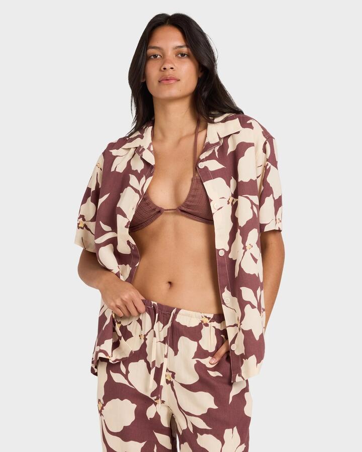 Image of a model wearing Tops. Productname: rvca - Womens Rhi Overshirt Short Sleeve Shirt - Terra Brown - in Terra Brown colour by brand - rvca