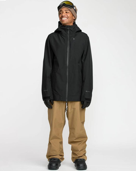 Image of a model wearing Pants. Product name - Volcom Mens Tester 3L Gore-Tex Snow Pants Bronze in Bronze colour by brand - Volcom