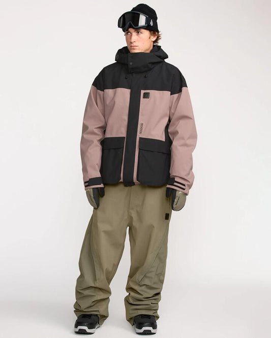 Image of a model wearing Pants. Productname: Volcom - Mens Kleveland Snow Pants - Military - in Military colour by brand - Volcom