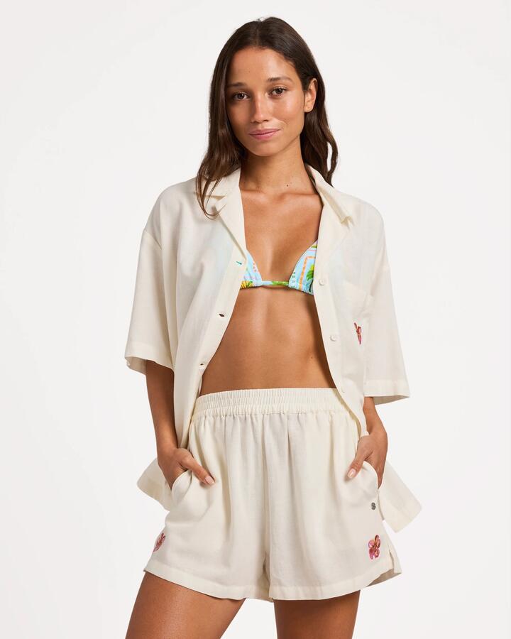 Image of a model wearing Shorts. Product name - Roxy Womens Hibiscus Elastic Waist Shorts Egret in Egret colour by brand - Roxy