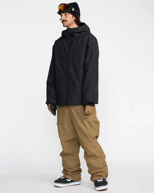 Image of a model wearing Pants. Productname: Volcom - Mens V.Co Sparta Bib Snow Pants - Bronze - in Bronze colour by brand - Volcom