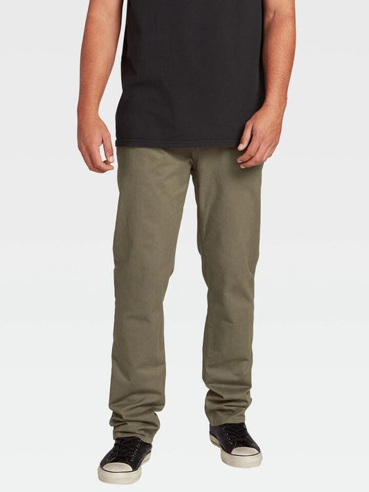 Image of a model wearing Pants. Product name - Volcom Mens Solver Lite 5 Pocket Chino Pants Army Green Combo in Army Green Combo colour by brand - Volcom