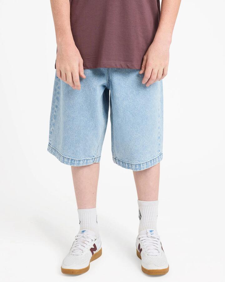 Image of a model wearing Shorts. Product name - Volcom Boys 8-16 Freazy Loose Denim Shorts Pale Aqua in Pale Aqua colour by brand - Volcom