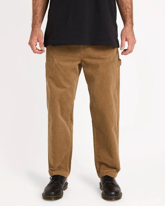 Image of a model wearing Pants. Productname: volcom Mens Kraftsman Dord Carpenter Pants Dark Khaki - in Dark Khaki colour by brand - Volcom