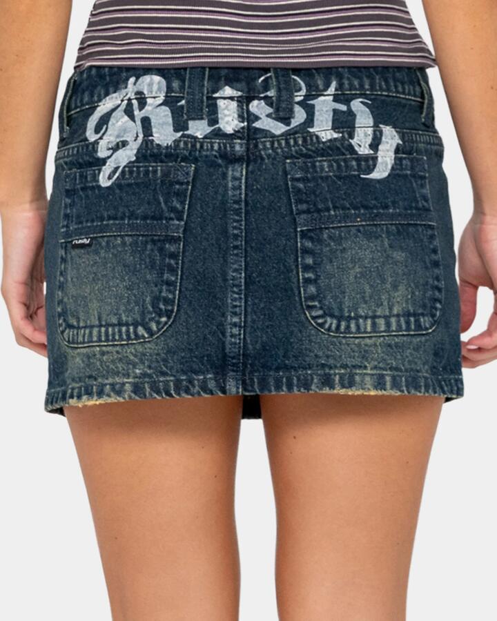 Image of a model wearing Skirts. Productname: rusty - Womens Roxanne Low Rise Denim Skirt - Dark N Dirty - in Dark N Dirty colour by brand - rusty