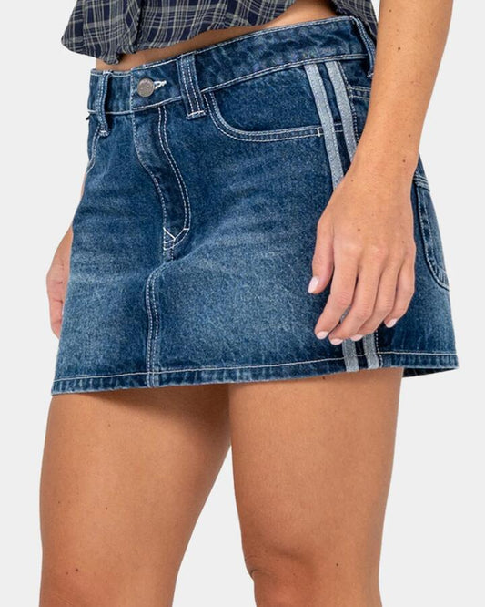 Image of a model wearing Skirts. Productname: rusty - Womens Flip Mommy Diy Low Rise Denim Skirt - Blasted Deep Sea Blu - in Blasted Deep Sea Blu colour by brand - rusty