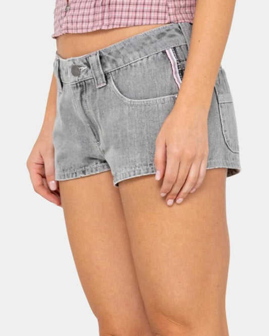 Image of a model wearing Shorts. Productname: rusty Womens Flip Mommy Low Rise Denim Shorts London Summer / Baby - in London Summer / Baby colour by brand - Rusty