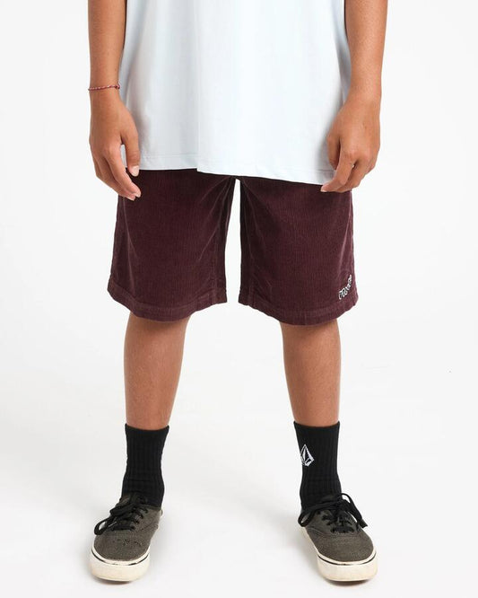 Image of a model wearing Shorts. Product name - Volcom Boys 8-16 Outer Spaced Walkshorts Pistol Punch in Pistol Punch colour by brand - Volcom