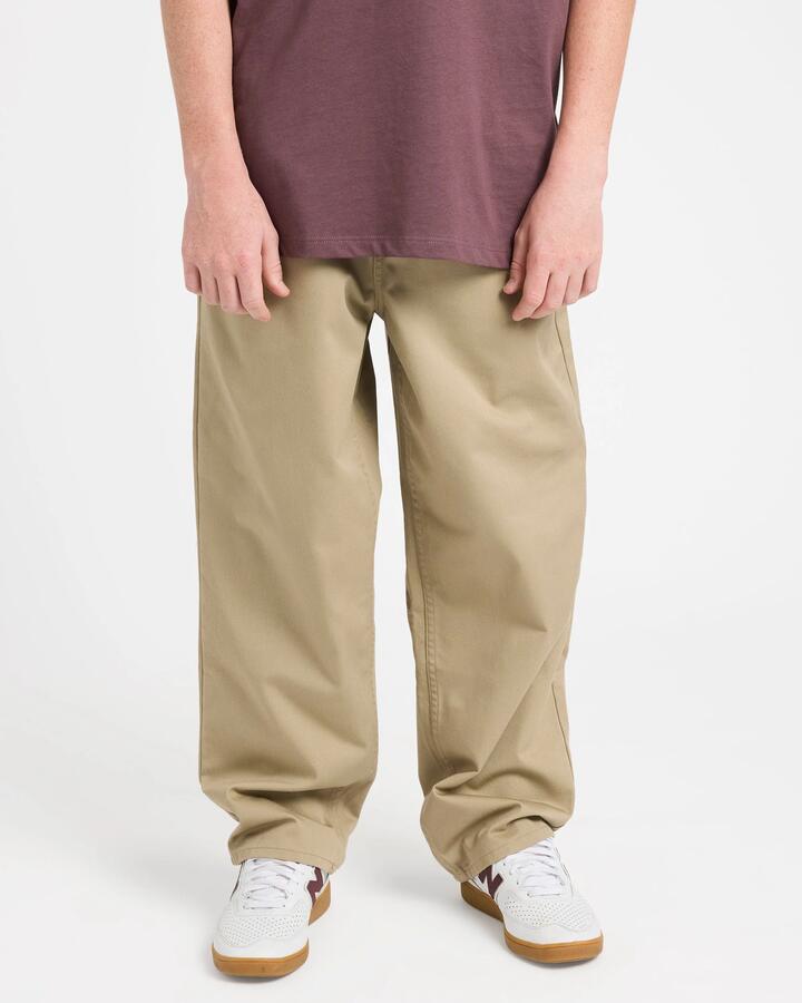 Image of a model wearing Pants. Product name - Volcom Boys 8-16 Freazy Pants Khaki in Khaki colour by brand - Volcom