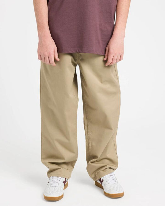 Image of a model wearing Pants. Product name - Volcom Boys 8-16 Freazy Pants Khaki in Khaki colour by brand - Volcom