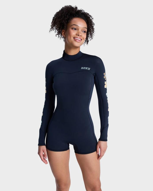 Image of a model wearing Tops. Product name - Roxy Womens 2Mm Swell Back Zip Natural Long Sleeve Springsuit Flower in Flower colour by brand - Roxy