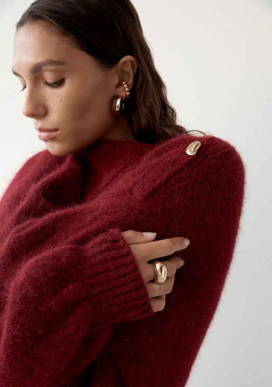 Image of a model wearing Outerwear. Productname: Vivienne Knit Jumper in Cranberry colour by brand - MOS The Label