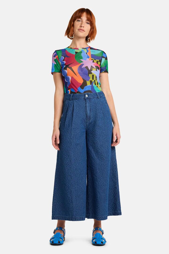 Image of a model wearing Skirts. Product name - Seersucker Denim Skort in Mid Blue colour by brand - Gorman