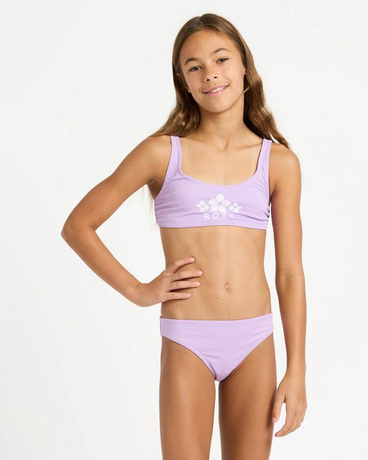 Image of a model wearing Tops. Product name - Roxy Girls 6-16 Solid Active Bralette Set Two Piece Crocus Petal in Crocus Petal colour by brand - Roxy