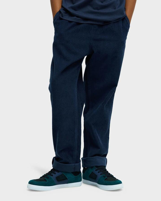 Image of a model wearing Pants. Product name - Quiksilver Boys 8-16 Taxer Corduroy Cargo Pants Dark Navy in Dark Navy colour by brand - Quiksilver