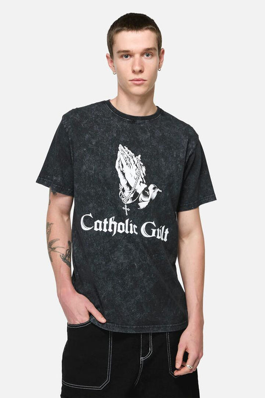 Image of a model wearing Tops. Productname: Catholic Guilt Unisex Tee in Vintage Black colour by brand - Pulp Kitchen