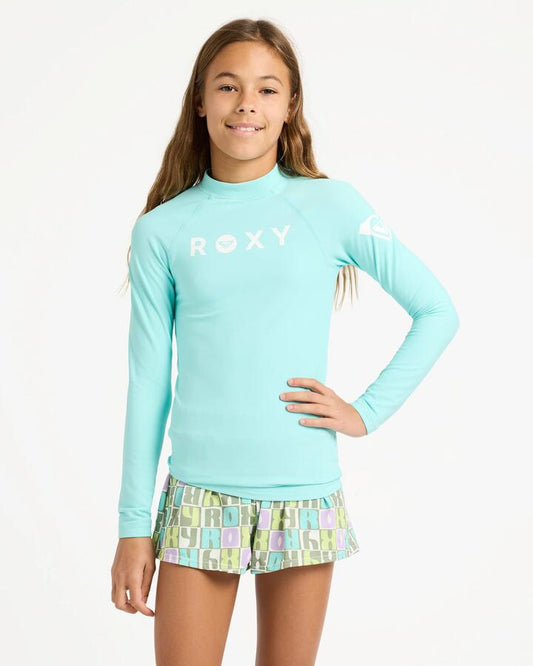 Image of a model wearing Tops. Product name - Roxy Girls 6-16 Girl Heater Long Sleeve Lycra Rash Vest Aqua Splash in Aqua Splash colour by brand - Roxy