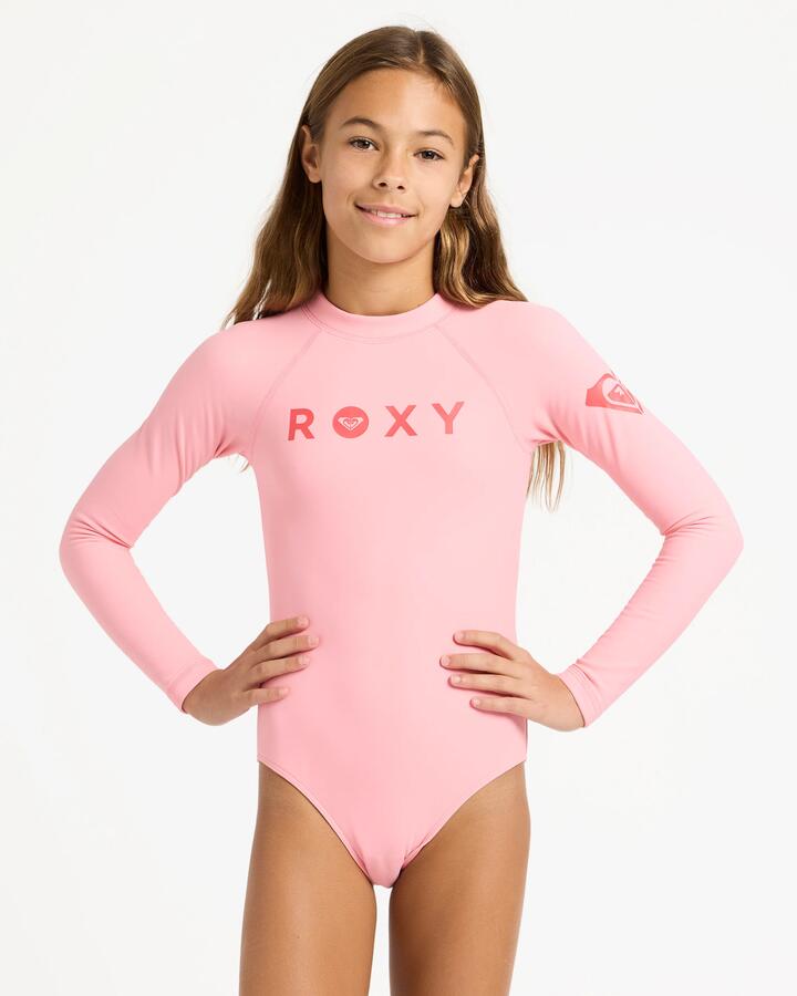 Image of a model wearing Tops. Product name - Roxy Girls 6-16 Heater Long Sleeve Rash Vest Plumeria in Plumeria colour by brand - Roxy
