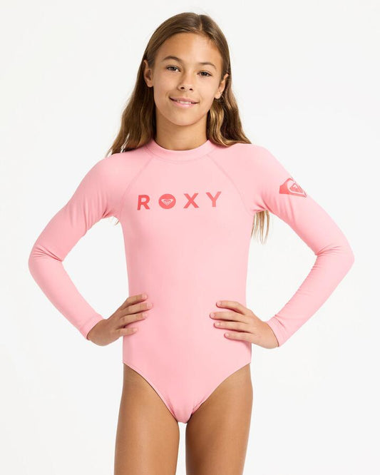 Image of a model wearing Tops. Product name - Roxy Girls 6-16 Heater Long Sleeve Rash Vest Plumeria in Plumeria colour by brand - Roxy