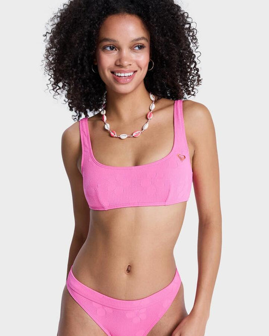 Image of a model wearing Tops. Productname: roxy Womens Roxy Paradise Bralette Bikini Top Sangria Sunset - in Sangria Sunset colour by brand - Roxy