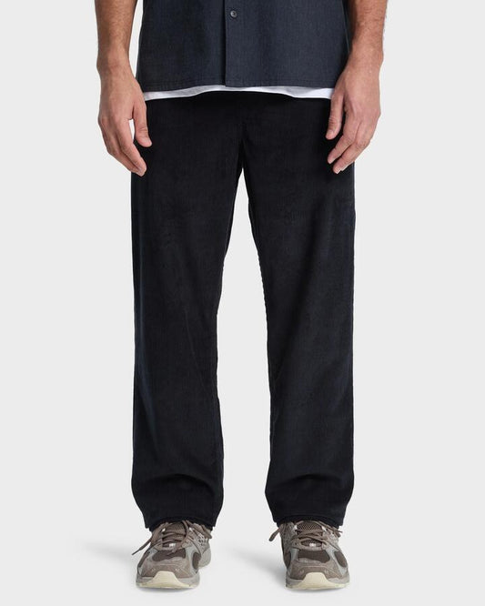 Image of a model wearing Pants. Product name - Quiksilver Mens Taxer Cord Pants Black in Black colour by brand - Quiksilver