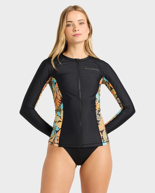 Image of a model wearing Tops. Productname: billabong Womens Des Tropiques Long Sleeve Rashvest Black Multi - in Black Multi colour by brand - Billabong