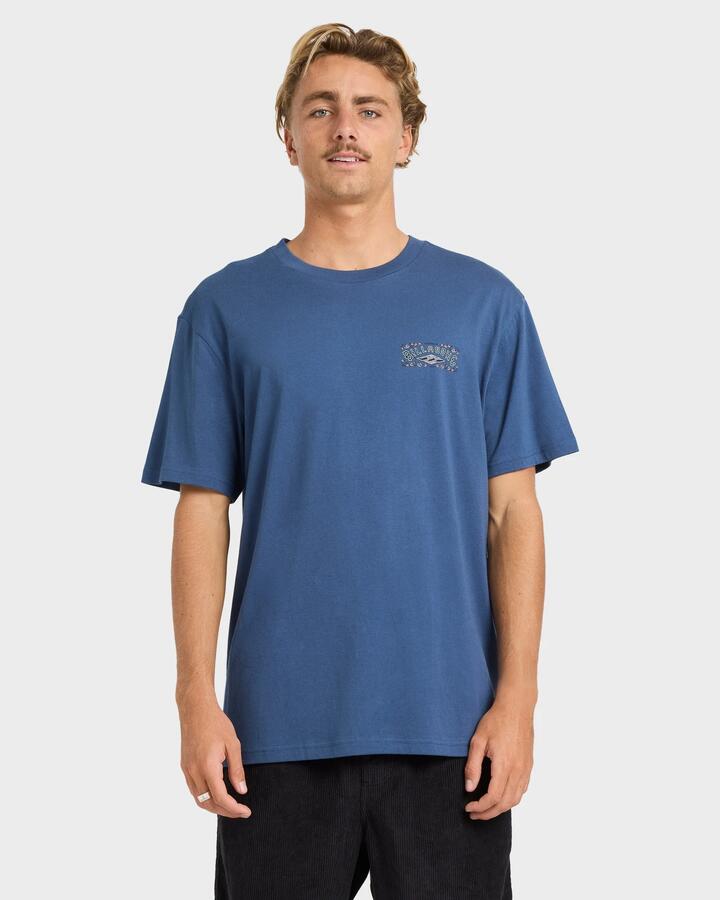 Image of a model wearing Tops. Productname: billabong - Mens Heritage Arch T-Shirt - Dark Denim - in Dark Denim colour by brand - billabong