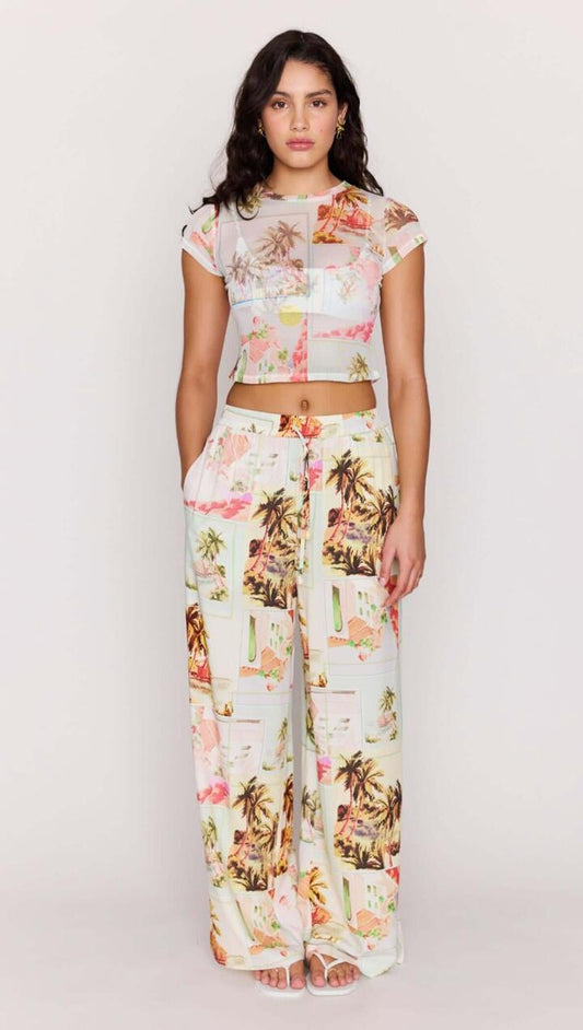 Image of a model wearing Pants. Product name - Vintage Postcard Print Drawstring Pants in Vintage Postcards colour by brand - MINKPINK