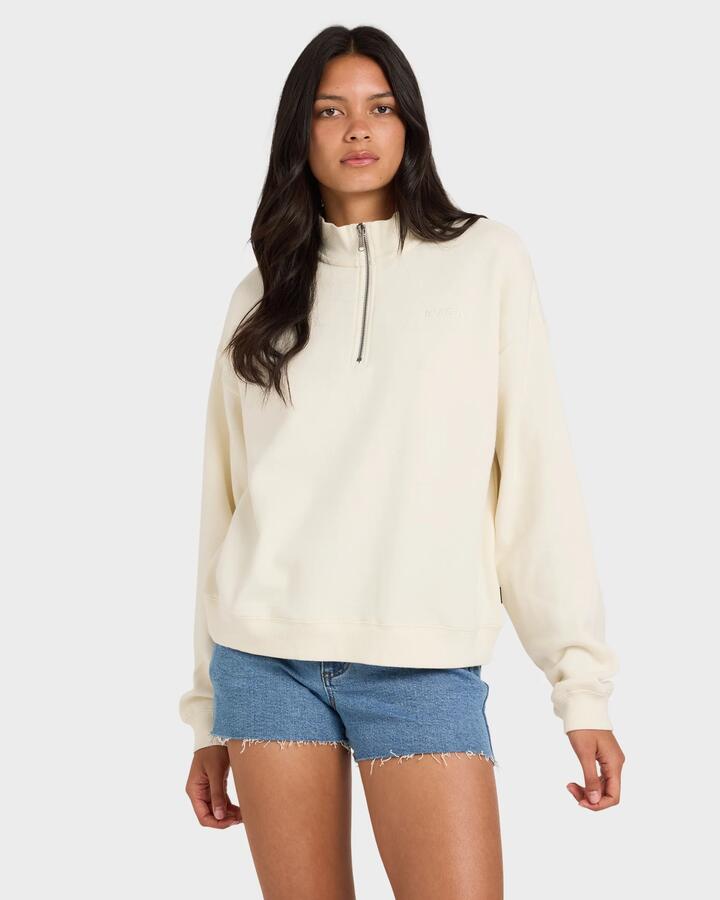 Image of a model wearing Outerwear. Product name - RVCA Womens Rvca 1/4 Zip Fleece Jumper Vintage White in Vintage White colour by brand - RVCA