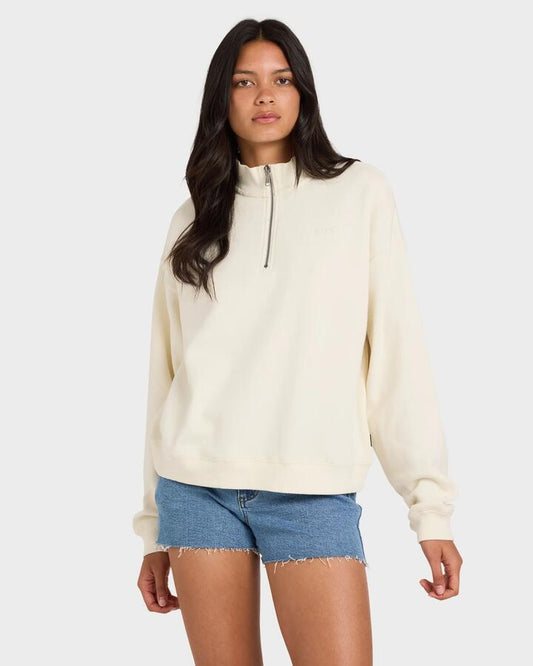 Image of a model wearing Outerwear. Product name - RVCA Womens Rvca 1/4 Zip Fleece Jumper Vintage White in Vintage White colour by brand - RVCA