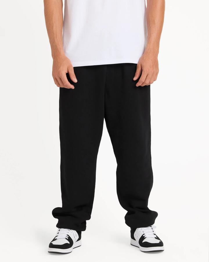 Image of a model wearing Pants. Product name - Quiksilver Mens Salt Water Trackpants Black in Black colour by brand - Quiksilver