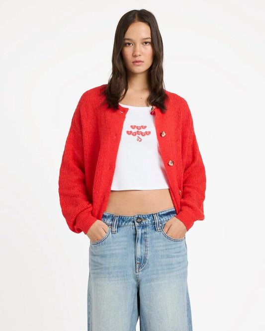 Image of a model wearing Outerwear. Productname: volcom - Womens Beach Please Cardigan - Fiesta Red - in Fiesta Red colour by brand - volcom