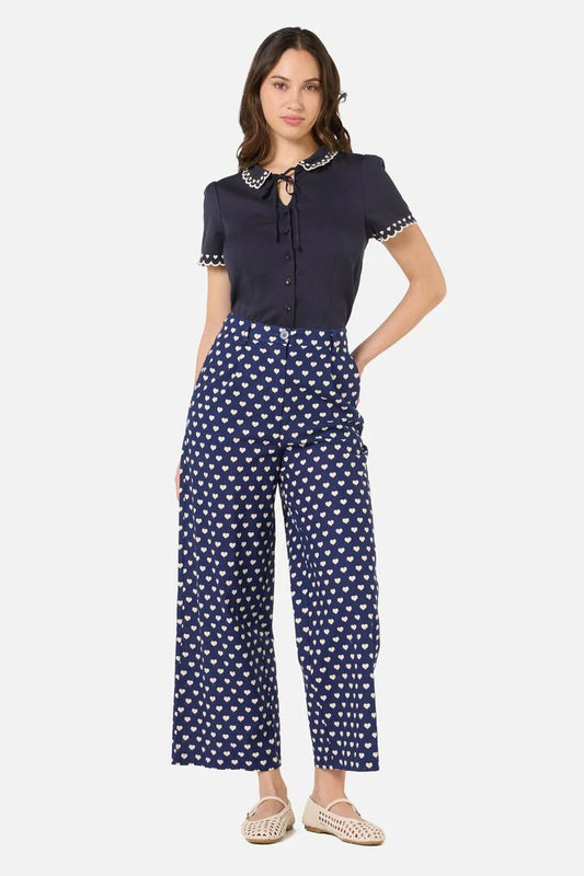 Image of a model wearing Pants. Productname: Sweet Heart Pant in Navy colour by brand - Princess Highway