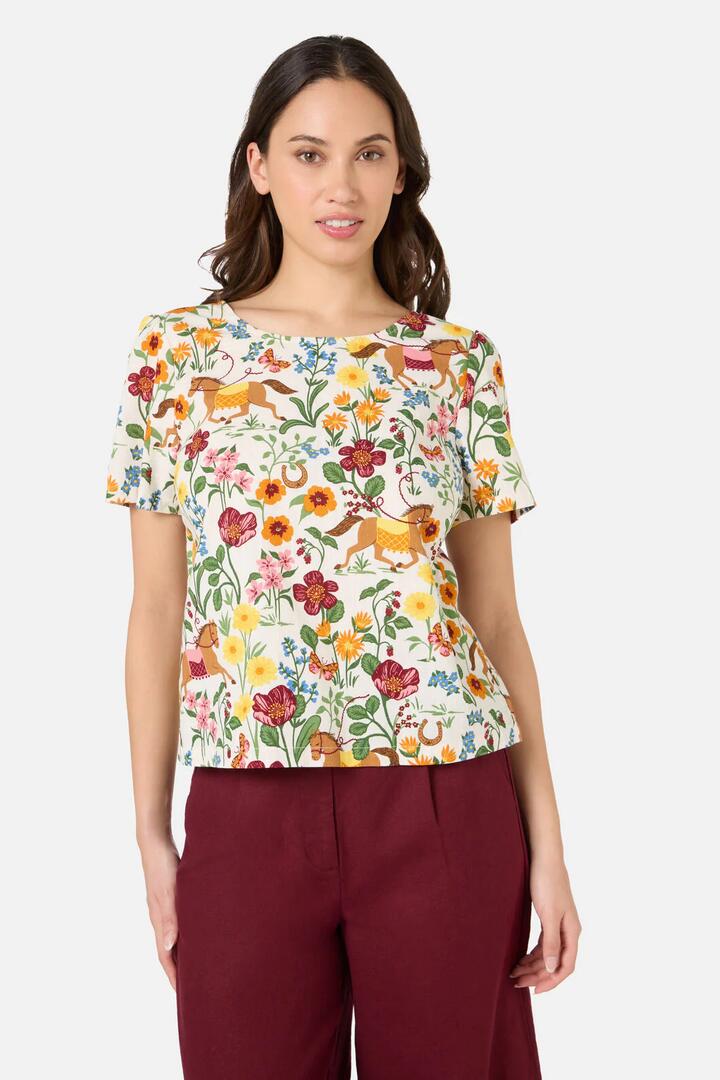 Image of a model wearing Tops. Productname: Fancy Horses Short Sleeve Top in Cream colour by brand - Princess Highway