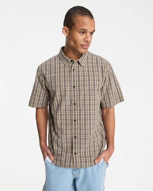 Image of a model wearing Tops. Productname: quiksilver - Mens Stonetown Short Sleeve Shirt - Seneca Check Stonetown - in Seneca Check Stonetown colour by brand - quiksilver