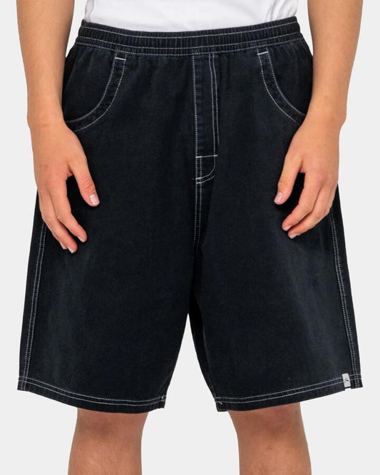 Image of a model wearing Shorts. Product name - Rusty Mens Flip Daddy Elastic Baggy Walkshorts Black in Black colour by brand - Rusty