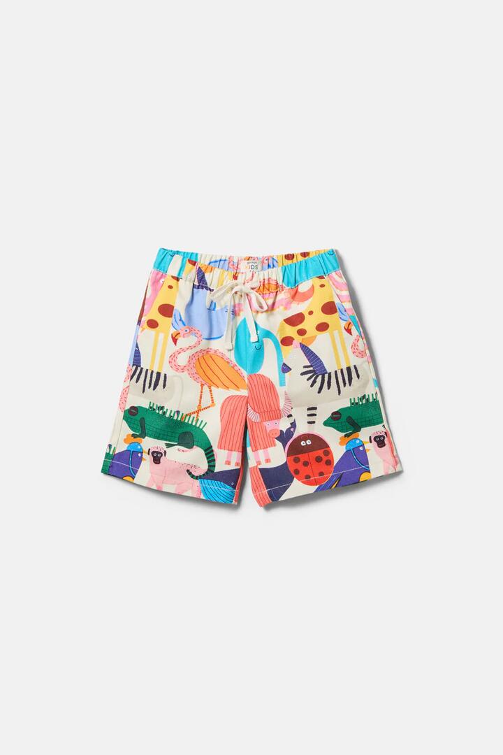 Image of a model wearing Shorts. Product name - Zoo Tropics Kids Shorts in Cream colour by brand - Gorman