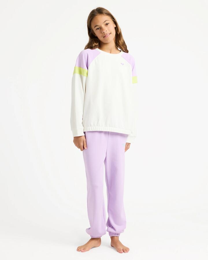 Image of a model wearing Pants. Product name - Roxy Girls 4-16 Surf Feeling Wide Trackpants Crocus Petal in Crocus Petal colour by brand - Roxy