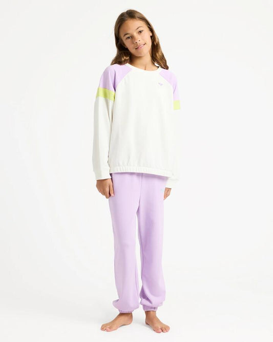 Image of a model wearing Pants. Product name - Roxy Girls 4-16 Surf Feeling Wide Trackpants Crocus Petal in Crocus Petal colour by brand - Roxy
